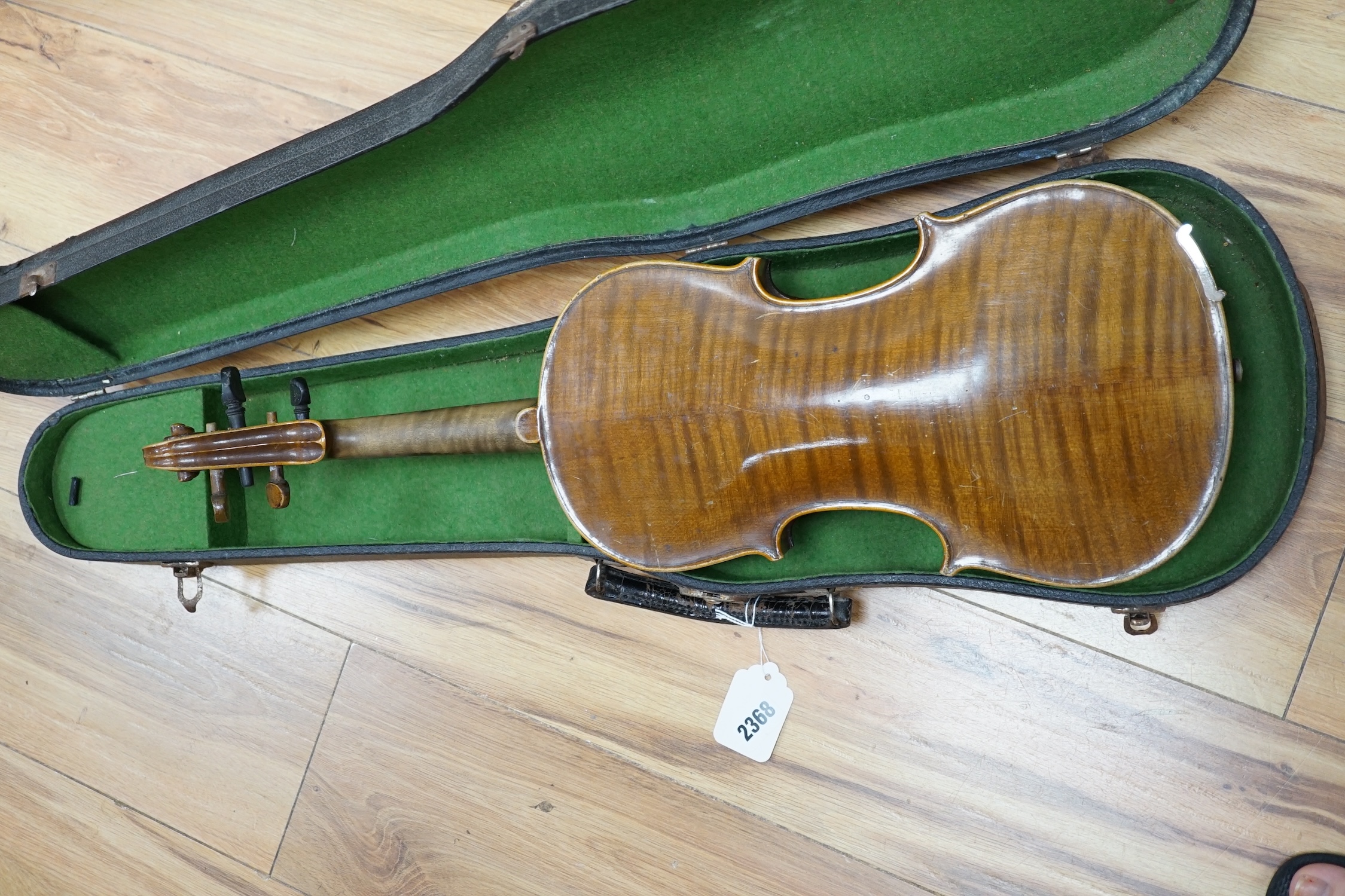 A cased late 19th century violin, back measures 36cm